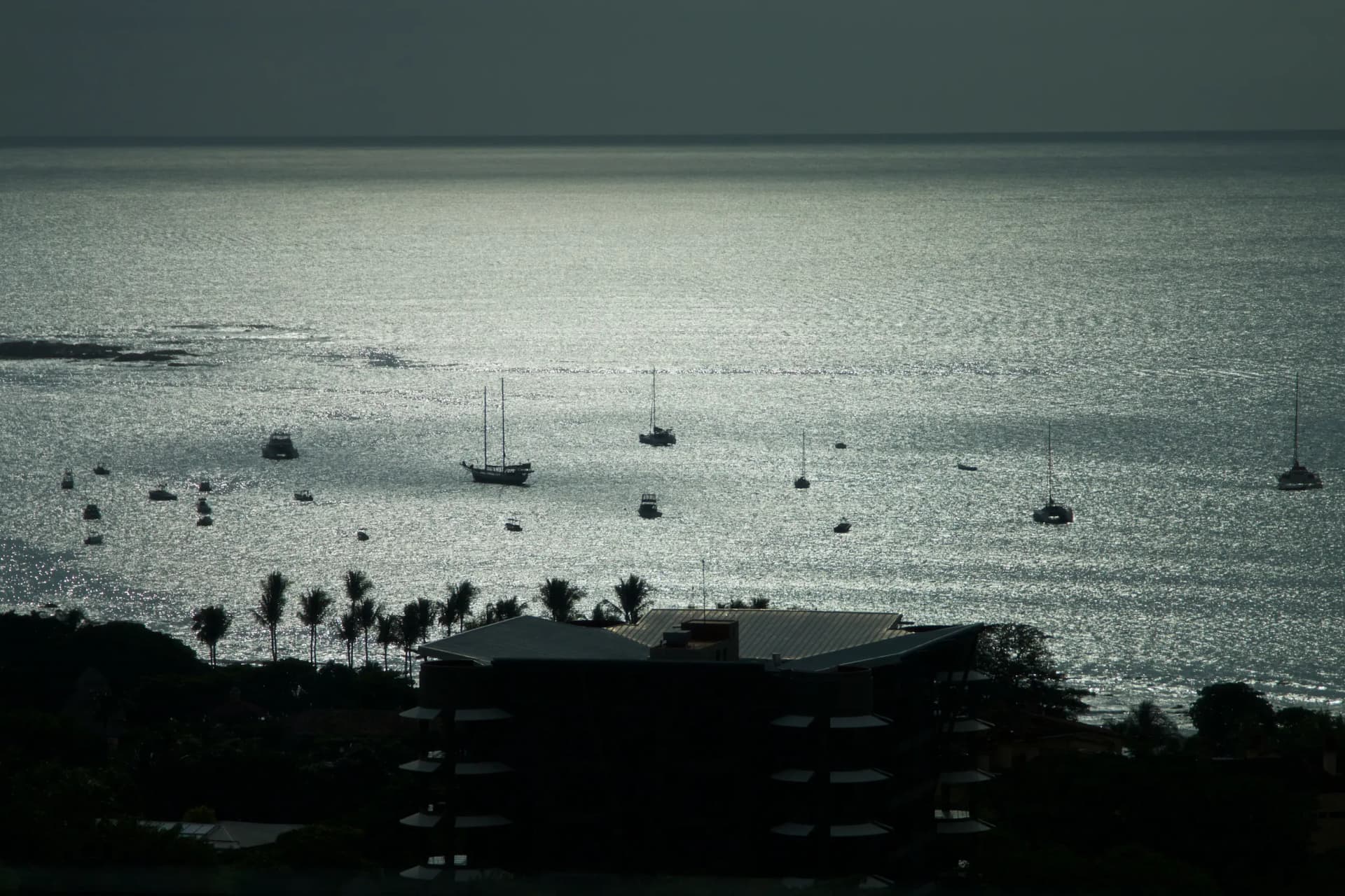 Boats anchored in Tamarindo bay at dusk, Guanacaste, Costa Rica